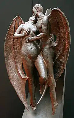 A winged male humanoid devil holds a naked woman as she touches her breast.